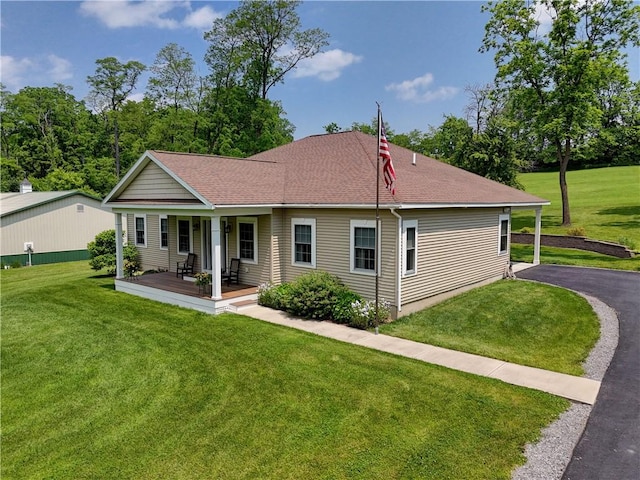 4338 State Route 90, Springport, NY 13160 - back of property with covered porch, a yard, and roof with shingles