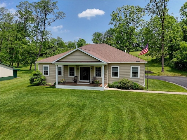 4338 State Route 90, Springport, NY 13160 - back of house with a porch, a lawn, and a shingled roof