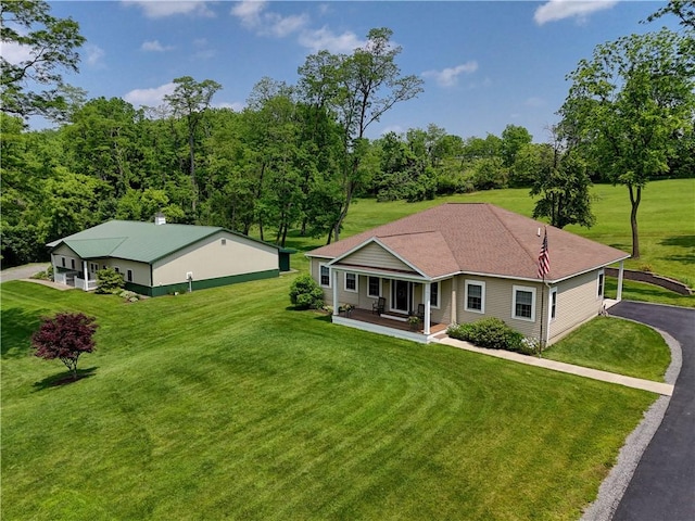 4338 State Route 90, Springport, NY 13160 - view of front of house featuring covered porch, a front lawn, and asphalt driveway