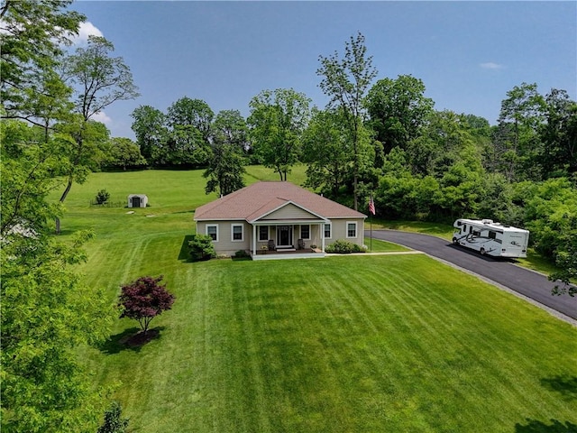 4338 State Route 90, Springport, NY 13160 - view of front of home featuring a porch, a front lawn, and asphalt driveway