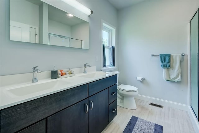 4338 State Route 90, Springport, NY 13160 - full bath featuring double vanity, wood finished floors, and a shower with shower door