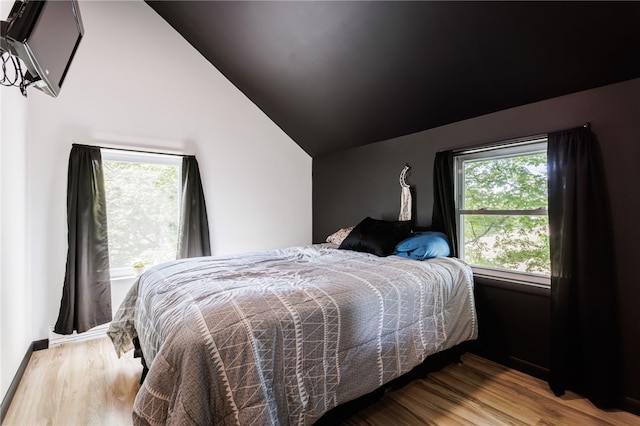 3839 Thompson Ave, Castile, NY 14549 - bedroom featuring vaulted ceiling and wood finished floors