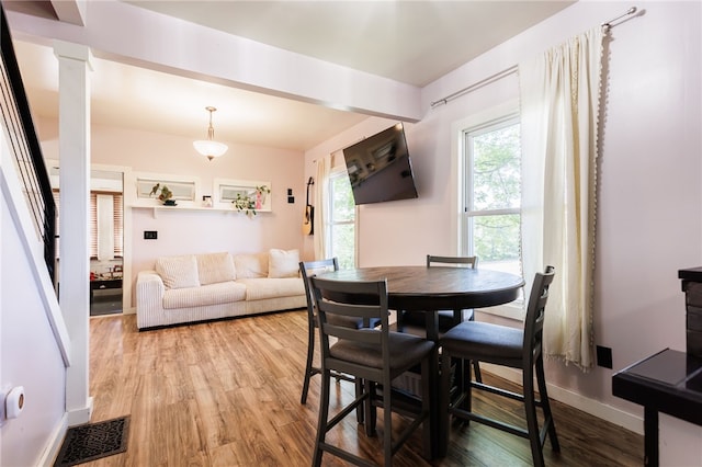3839 Thompson Ave, Castile, NY 14549 - dining room featuring light wood-style floors and decorative columns