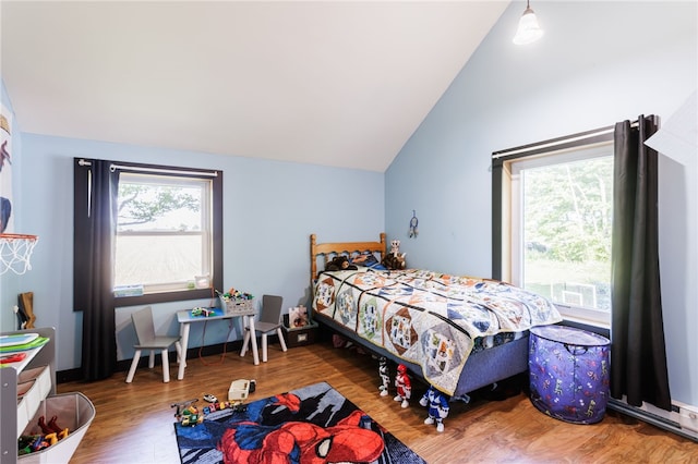 3839 Thompson Ave, Castile, NY 14549 - bedroom with multiple windows, vaulted ceiling, and wood finished floors