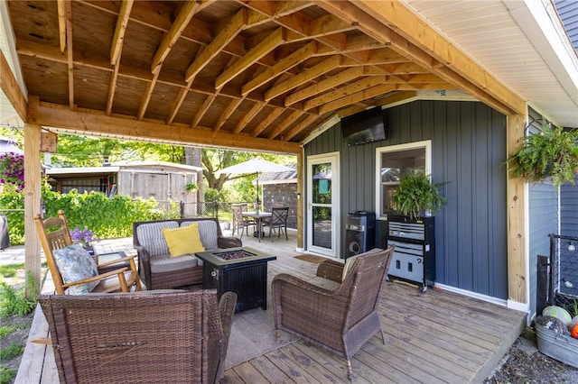 3839 Thompson Ave, Castile, NY 14549 - wooden terrace featuring an outdoor living space with a fire pit