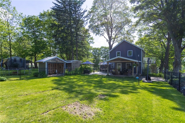 3839 Thompson Ave, Castile, NY 14549 - fenced backyard featuring an outdoor structure and a patio