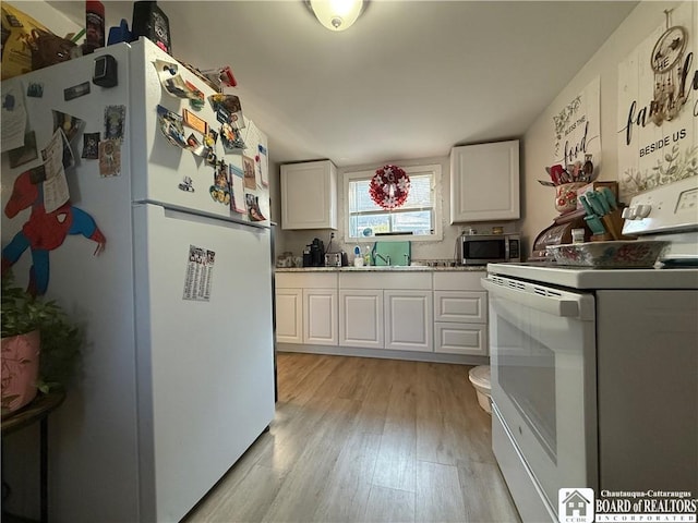 421 E Connell St, Olean-City, NY 14760 - kitchen featuring white appliances, white cabinetry, and light wood-style floors