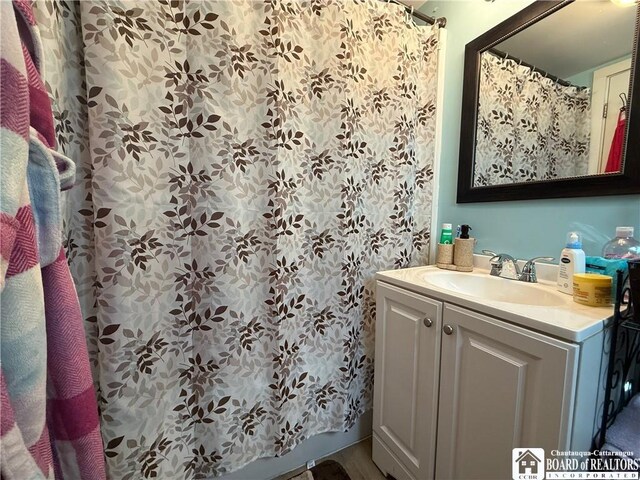 421 E Connell St, Olean-City, NY 14760 - full bath with vanity and a shower with curtain