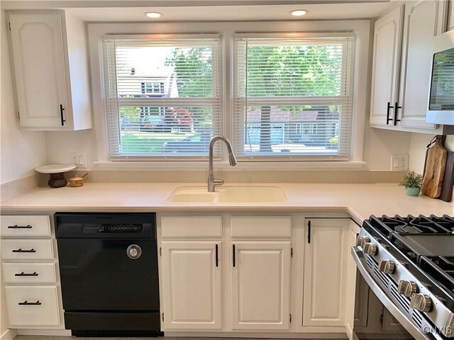 17 Benton Cir, New Hartford, NY 13501 - kitchen featuring appliances with stainless steel finishes, white cabinetry, and plenty of natural light