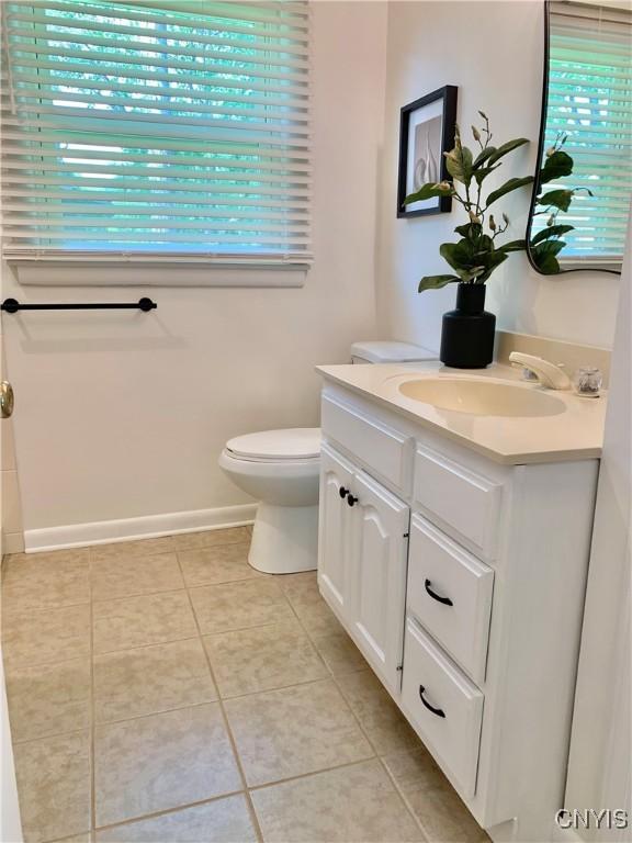 17 Benton Cir, New Hartford, NY 13501 - bathroom with vanity, plenty of natural light, and tile patterned floors