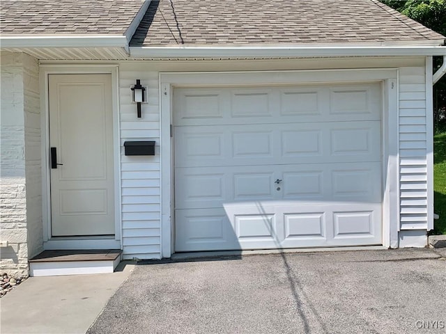 17 Benton Cir, New Hartford, NY 13501 - garage featuring asphalt driveway