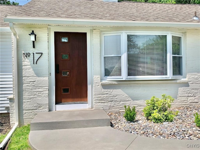 17 Benton Cir, New Hartford, NY 13501 - entrance to property featuring a shingled roof