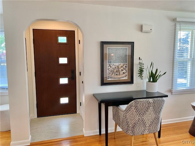 17 Benton Cir, New Hartford, NY 13501 - foyer with arched walkways, light wood-style flooring, and healthy amount of natural light