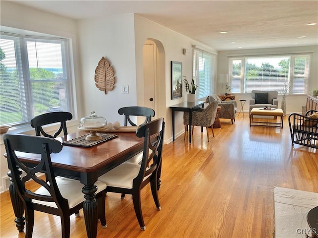 17 Benton Cir, New Hartford, NY 13501 - dining area featuring light wood-type flooring, arched walkways, and recessed lighting
