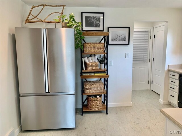 17 Benton Cir, New Hartford, NY 13501 - kitchen with freestanding refrigerator, light countertops, and white cabinets