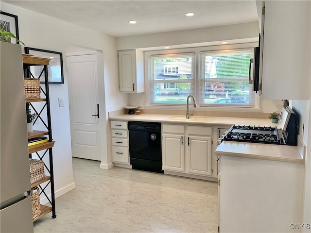 17 Benton Cir, New Hartford, NY 13501 - kitchen with dishwasher, freestanding refrigerator, white cabinets, range with gas cooktop, and light countertops