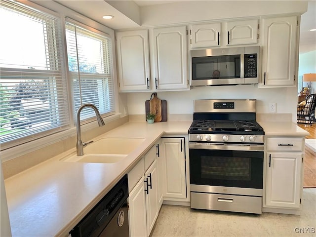 17 Benton Cir, New Hartford, NY 13501 - kitchen featuring stainless steel appliances, white cabinets, light countertops, and recessed lighting
