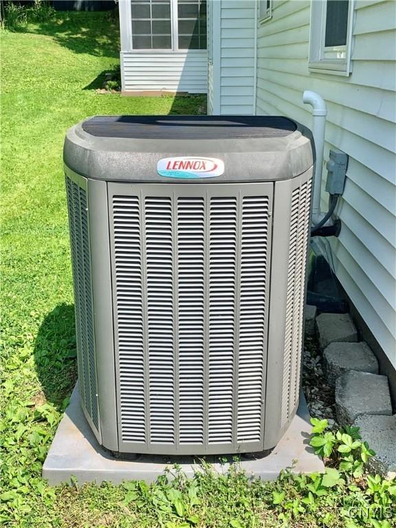 17 Benton Cir, New Hartford, NY 13501 - exterior view of a central air condition unit