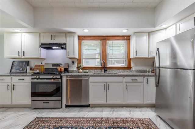 234 Depew St, Rochester, NY 14611 - kitchen featuring stainless steel appliances, under cabinet range hood, light stone countertops, and white cabinetry