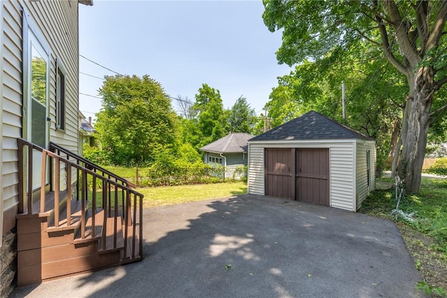 234 Depew St, Rochester, NY 14611 - detached garage featuring a shed and view of scattered trees