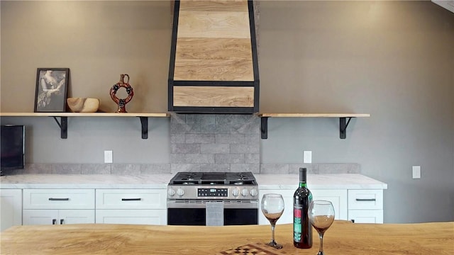 3228 County Road 28, Reading, NY 14891 - kitchen featuring open shelves, stainless steel gas stove, tasteful backsplash, and white cabinets