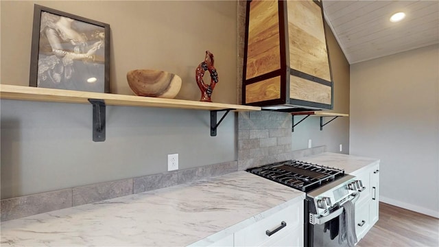 3228 County Road 28, Reading, NY 14891 - kitchen featuring stainless steel gas range, light wood-style flooring, recessed lighting, white cabinets, and light stone countertops