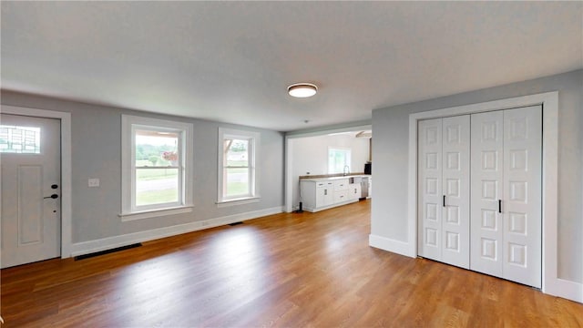 3228 County Road 28, Reading, NY 14891 - unfurnished living room with wood finished floors and healthy amount of natural light