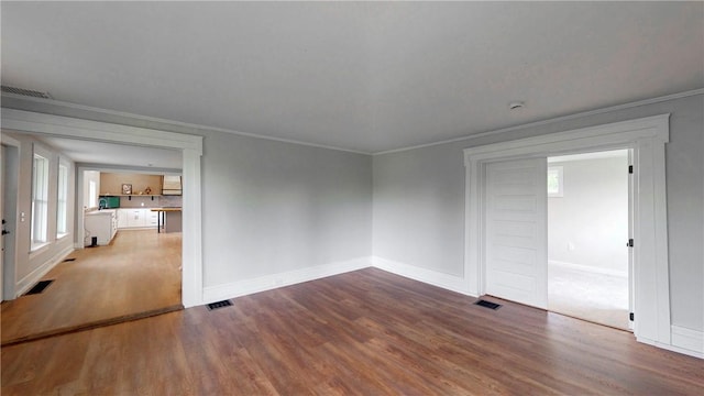 3228 County Road 28, Reading, NY 14891 - unfurnished room with wood finished floors, crown molding, and healthy amount of natural light