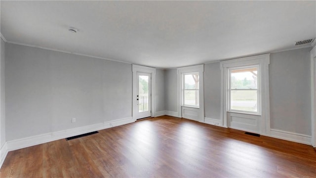 3228 County Road 28, Reading, NY 14891 - unfurnished room featuring wood finished floors, plenty of natural light, ornamental molding, and a smoke detector