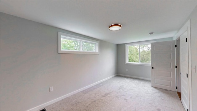 3228 County Road 28, Reading, NY 14891 - unfurnished bedroom featuring multiple windows and light colored carpet