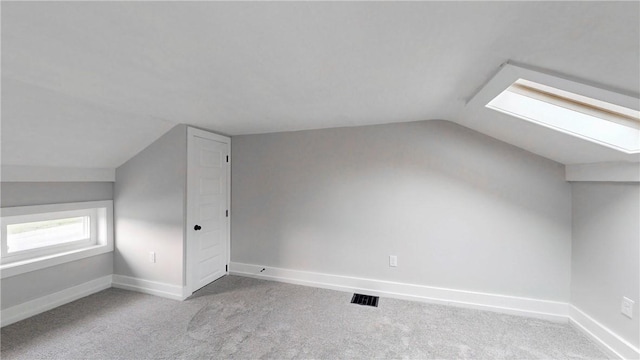 3228 County Road 28, Reading, NY 14891 - additional living space with vaulted ceiling, carpet floors, and a skylight