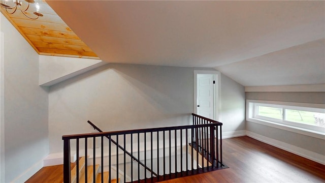 3228 County Road 28, Reading, NY 14891 - staircase with lofted ceiling, wood finished floors, and a chandelier