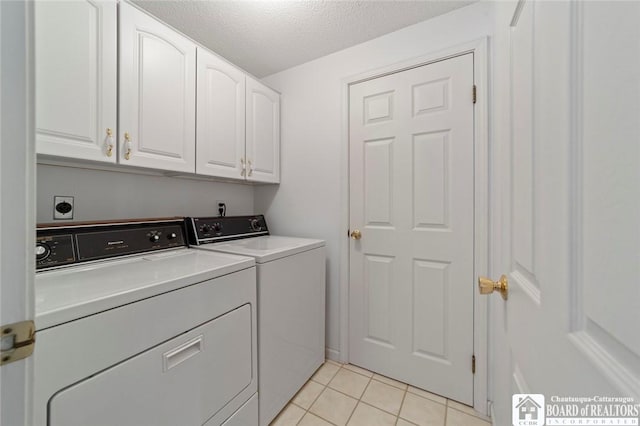 12 Ahrens Pl, Pomfret, NY 14063 - laundry room with cabinet space, independent washer and dryer, light tile patterned floors, and a textured ceiling
