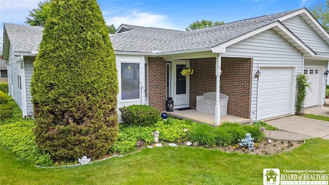 12 Ahrens Pl, Pomfret, NY 14063 - ranch-style home with a shingled roof, a garage, a front yard, and brick siding