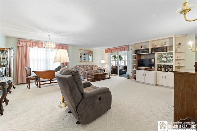 12 Ahrens Pl, Pomfret, NY 14063 - carpeted living room with a chandelier