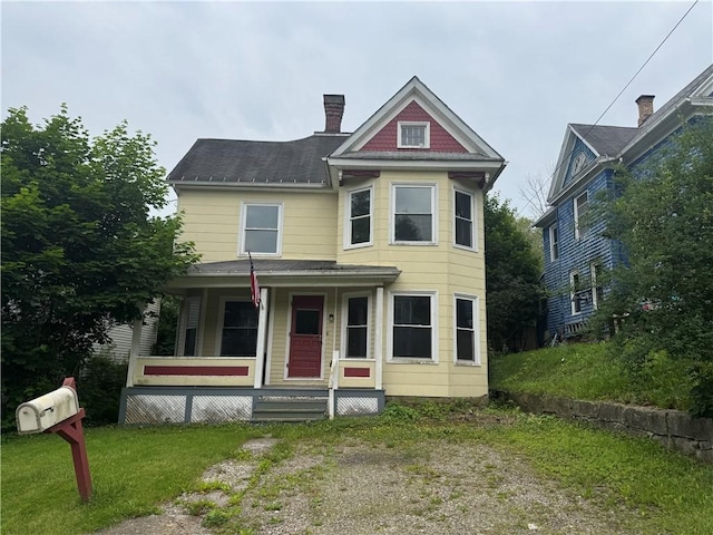 14 Sherman St, Bradford-City, PA 16701 - victorian-style house with a porch, a chimney, roof with shingles, and a front lawn