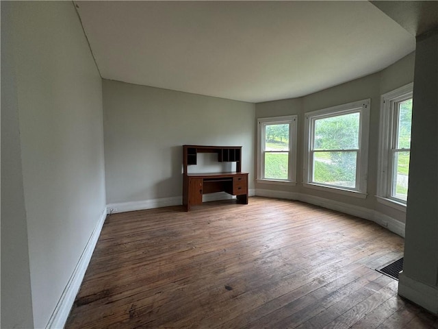 14 Sherman St, Bradford-City, PA 16701 - unfurnished living room with baseboards and wood-type flooring
