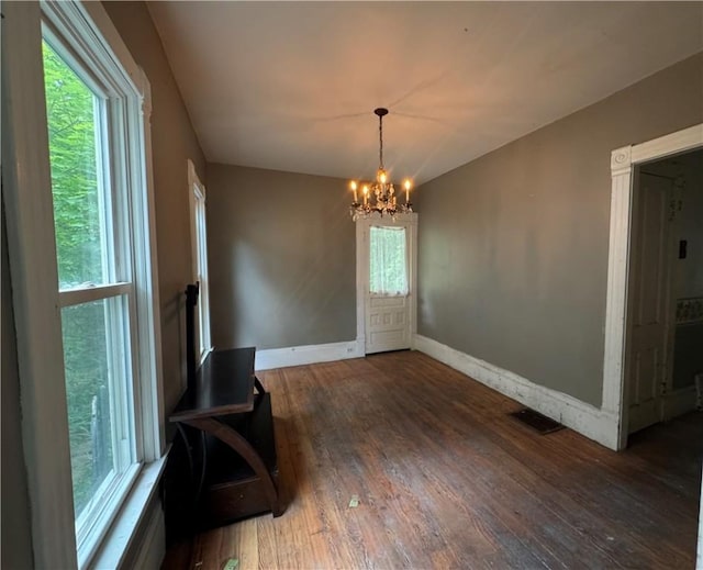 14 Sherman St, Bradford-City, PA 16701 - unfurnished dining area with a chandelier, wood finished floors, and plenty of natural light