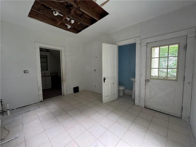 14 Sherman St, Bradford-City, PA 16701 - unfurnished bedroom with light tile patterned flooring and ensuite bath