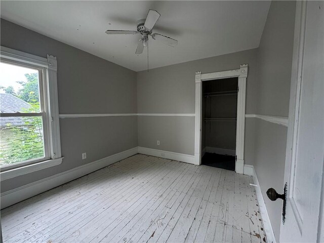 14 Sherman St, Bradford-City, PA 16701 - unfurnished bedroom with hardwood / wood-style floors, multiple windows, a closet, and ceiling fan