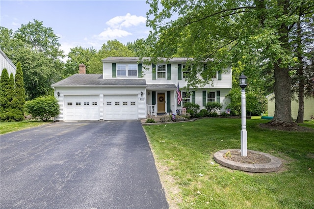 208 Blackwell Ln, Henrietta, NY 14467 - view of front of home with driveway, an attached garage, a front lawn, and a chimney