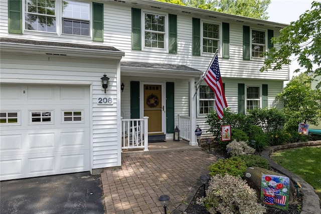 208 Blackwell Ln, Henrietta, NY 14467 - view of front of property with an attached garage