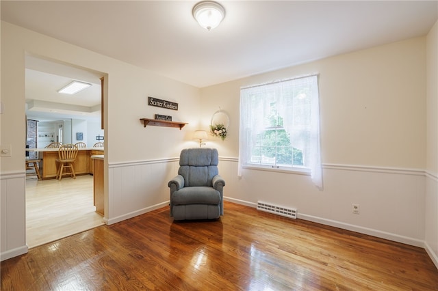 208 Blackwell Ln, Henrietta, NY 14467 - living area featuring wood finished floors and wainscoting