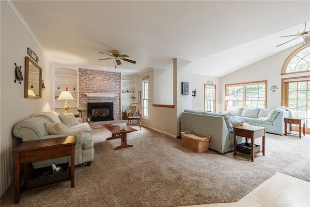 208 Blackwell Ln, Henrietta, NY 14467 - carpeted living room with a ceiling fan, a fireplace, built in shelves, and vaulted ceiling