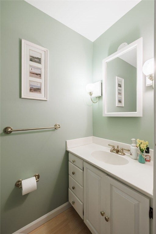 208 Blackwell Ln, Henrietta, NY 14467 - bathroom with vanity and wood finished floors