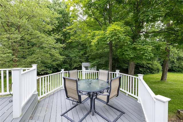 208 Blackwell Ln, Henrietta, NY 14467 - deck with outdoor dining area, a storage unit, and a yard