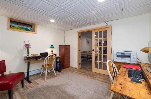 377 Bingham Center Rd, Bingham, PA 16923 - office space with an ornate ceiling, wood finished floors, recessed lighting, french doors, and a baseboard heating unit