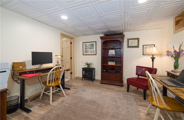 377 Bingham Center Rd, Bingham, PA 16923 - office space with a wood stove, an ornate ceiling, light wood-style flooring, and recessed lighting