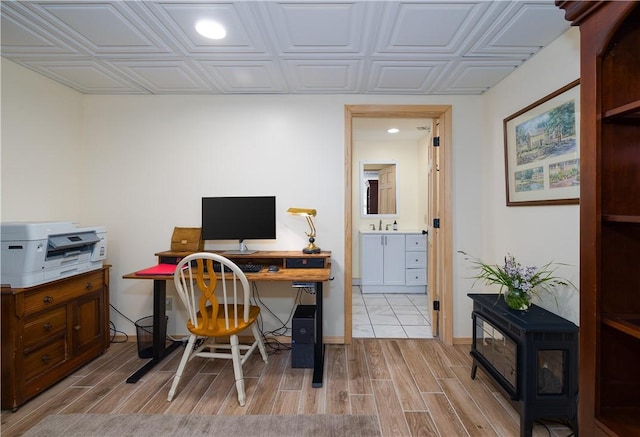 377 Bingham Center Rd, Bingham, PA 16923 - office with light wood-style flooring, recessed lighting, and a wood stove