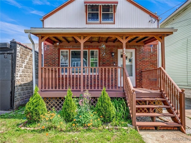 45 Eckhert St, Buffalo, NY 14207 - view of front of house with brick siding and a porch